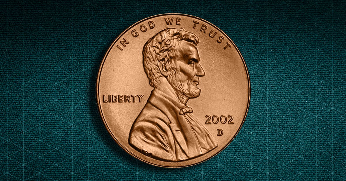 A 2002 Lincoln Cent against a decorative background.