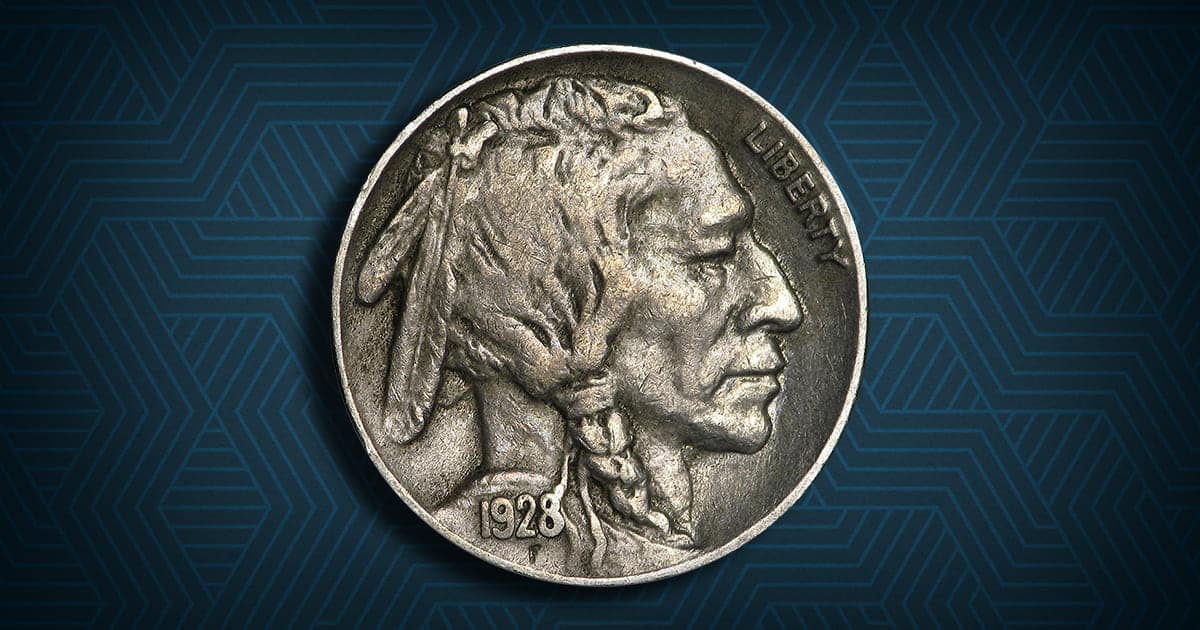 A 1928 Buffalo Nickel resting against a patterned background.