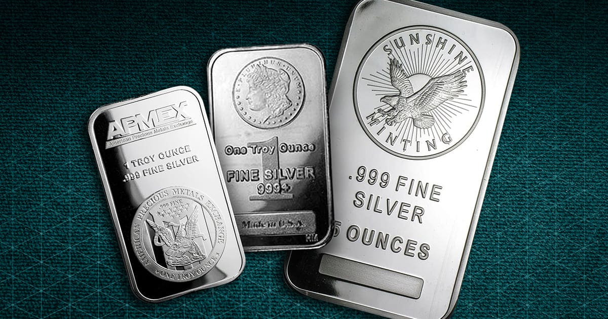 Two One-Ounce Silver Bars and One Five-Ounce Silver Bar in Front of a Patterned Background.
