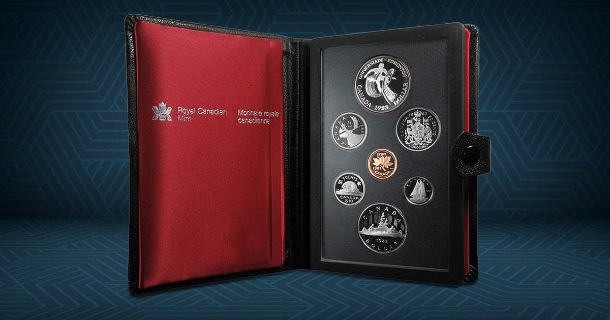 A 1983 Canadian coin album is open, revealing the coins inside.