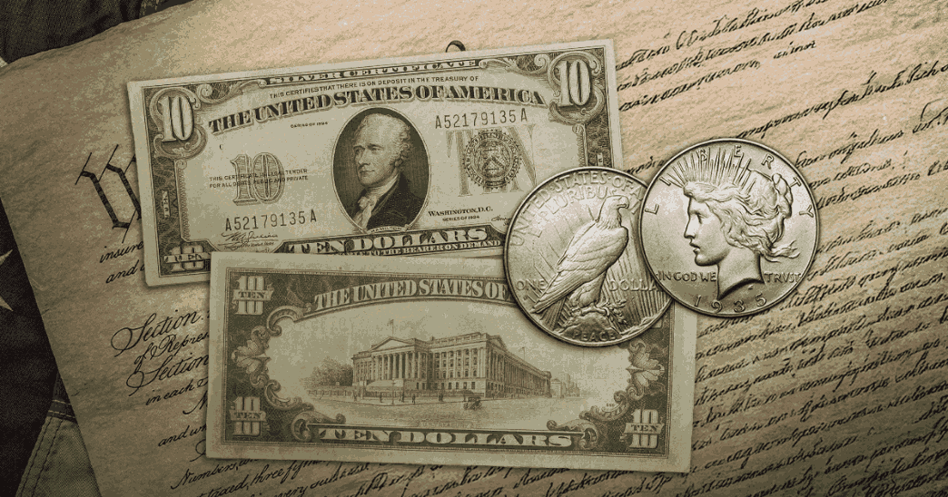United States silver currency on top of the Declaration of Independence.  