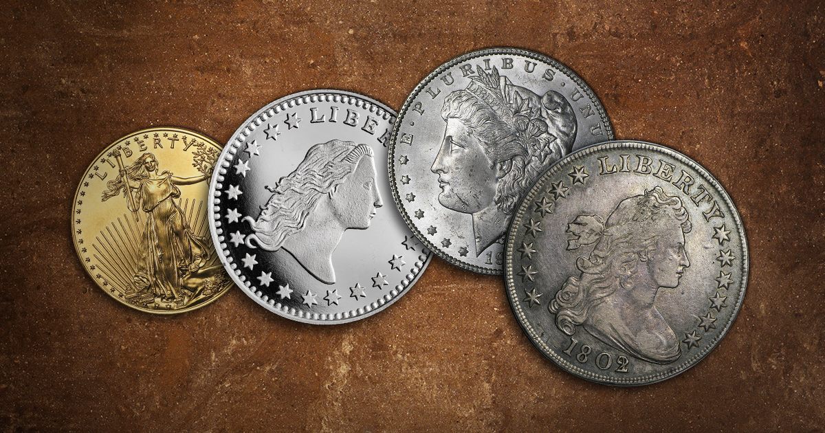 A collection of coins that feature Lady Liberty sit on a table.