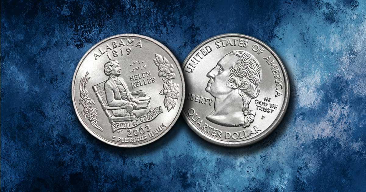 Two Alabama state quarters on a table.