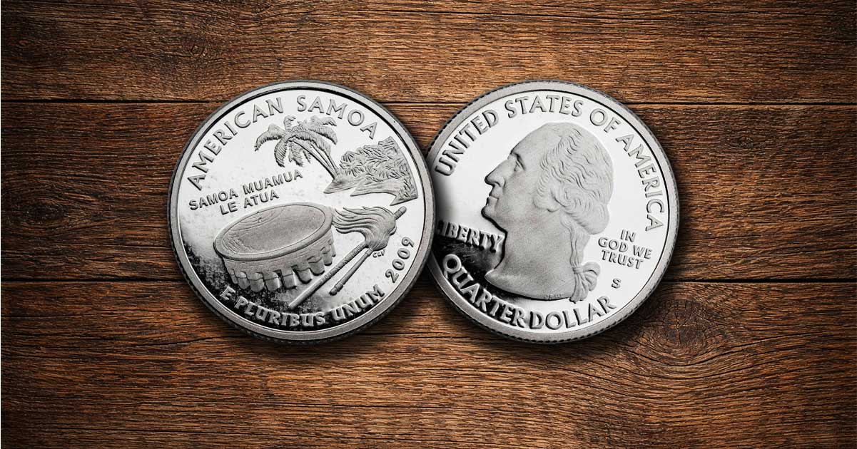 Two American Samoa quarters sit on a table.