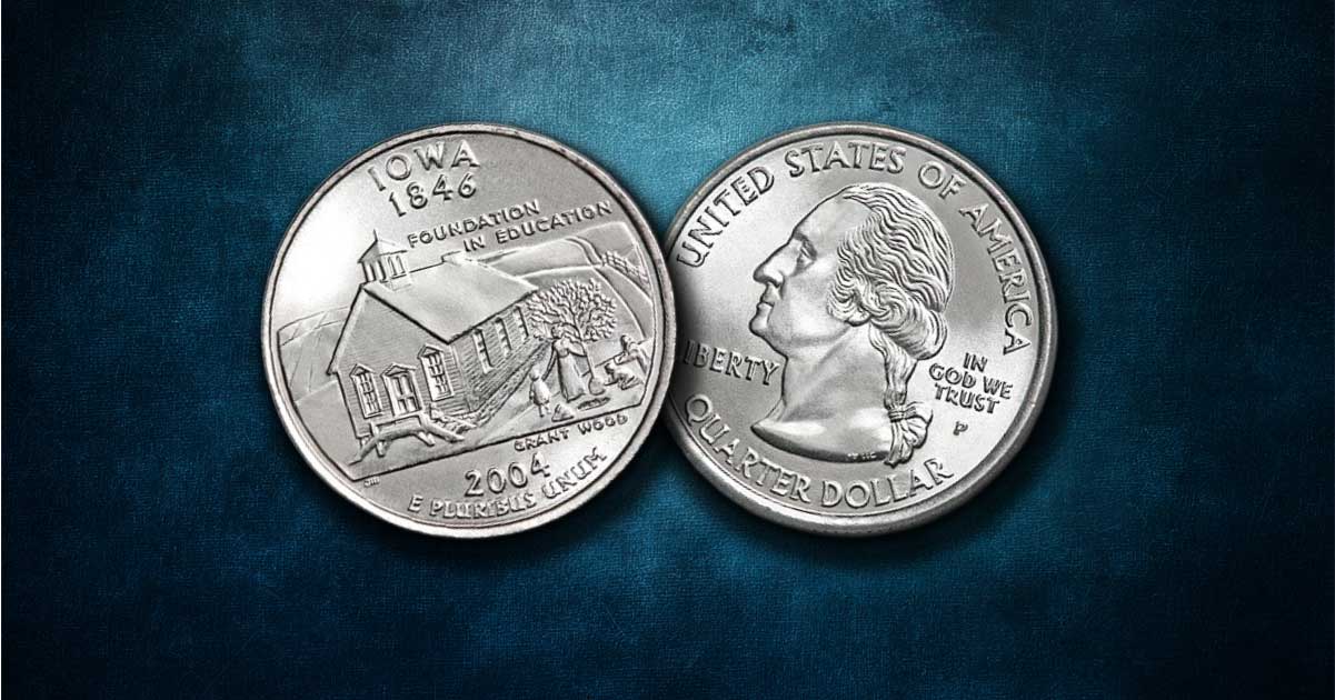 Two Iowa state quarters on a table.