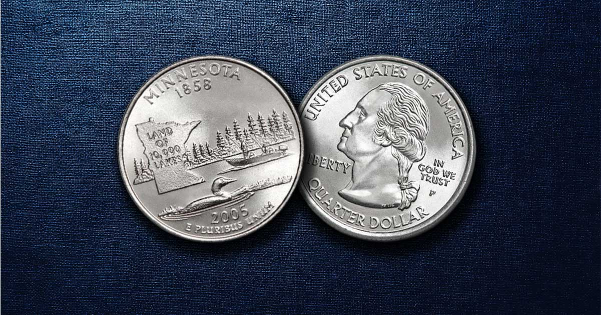 Two Minnesota state quarters on a table.