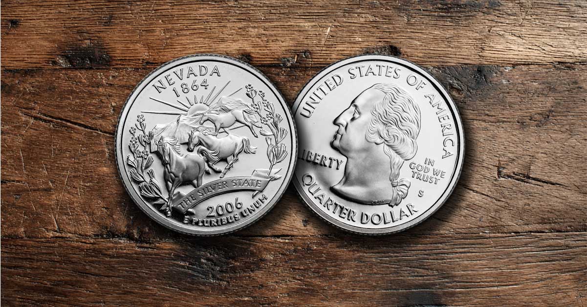 Two Nevada state quarters sit on a table.