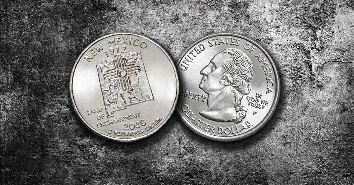 Two New Mexico state quarters on a table.