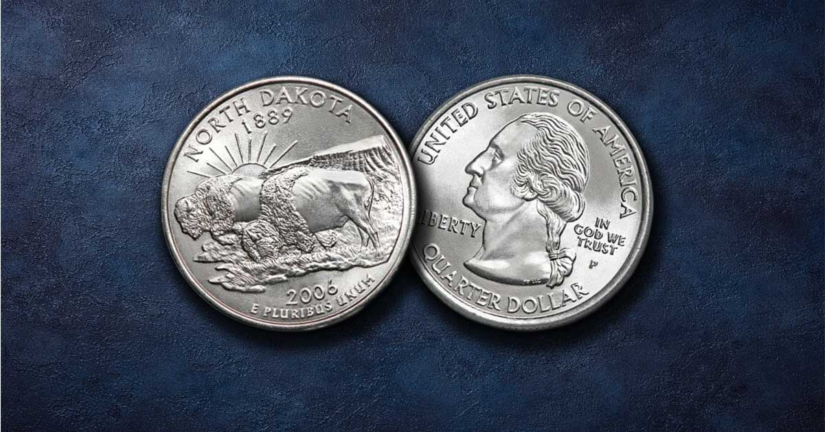 Two North Dakota quarters on a table.