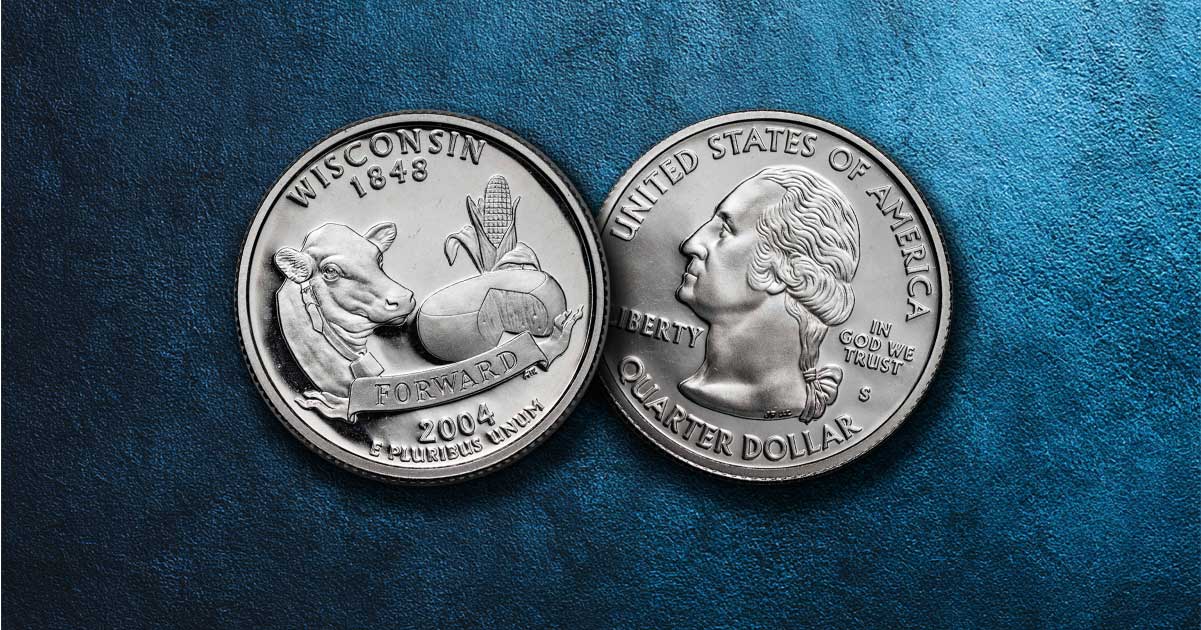 Two Wisconsin state quarters sit on a table.