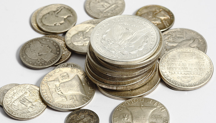 Stacks and scatters of numismatic coins.